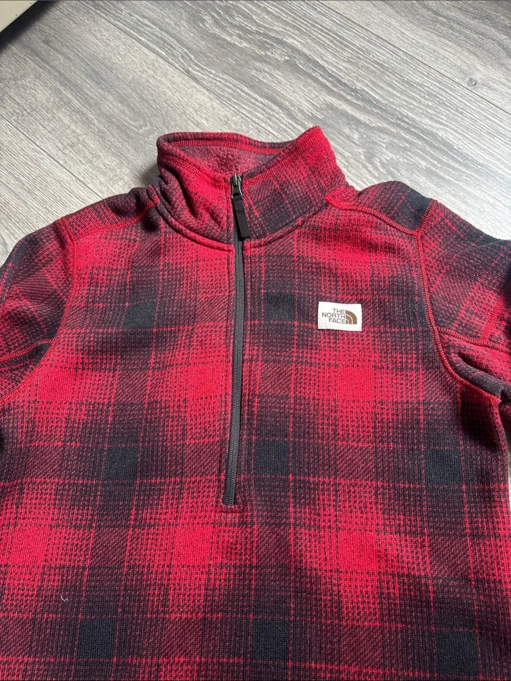 The North Face Men’s Red and Black Plaid Quarter-Zip Fleece